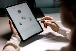 Women,With,Smart,Device,Monitor,Home,Electricity,Production,By,Photovoltaic