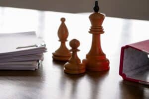 Hierarchy,And,Succession,Planning.,Chess,Pieces,On,The,Office,Table.